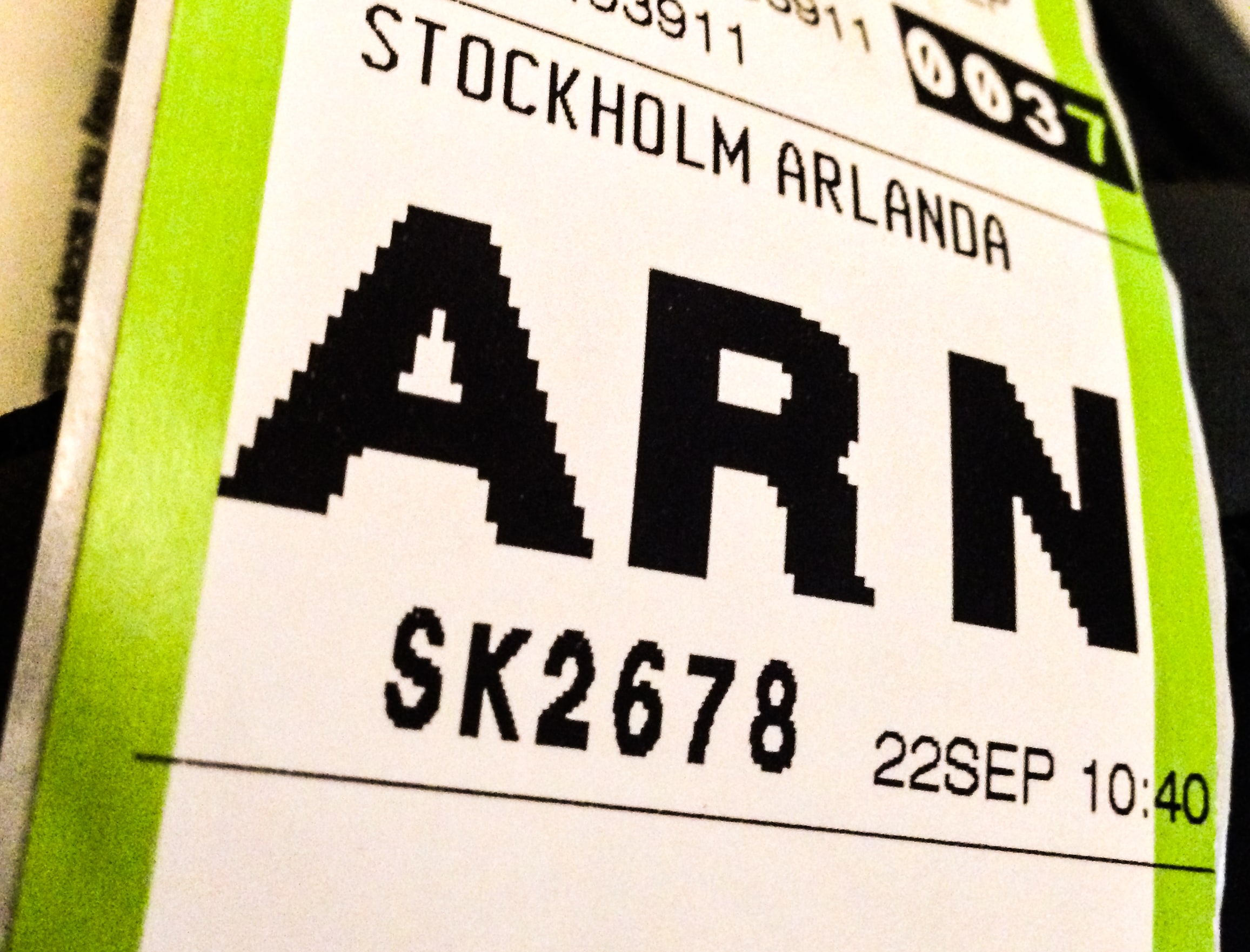 A close-up of a baggage tag marked Stockholm Arlanda and ARN.