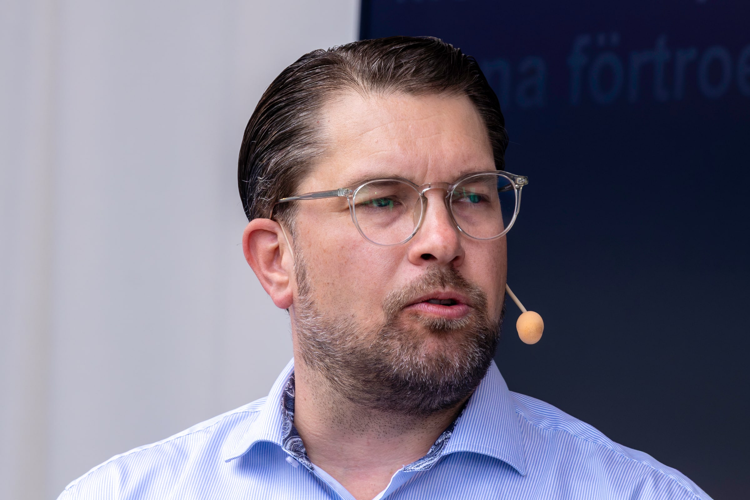 Jimmie Åkesson speaking with a headset microphone at Almedalen in June 2026.