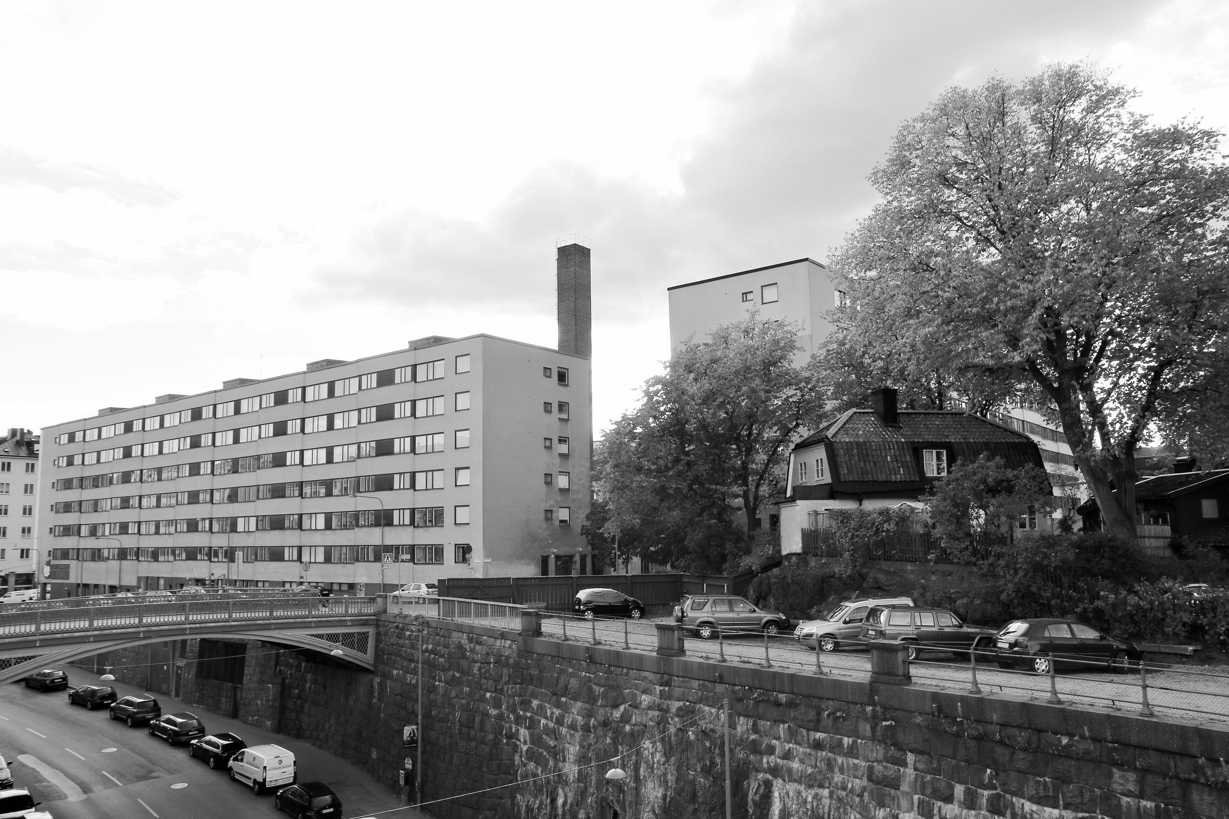 Apartment blocks and a small house stand side by side in Södermalm, Stockholm.