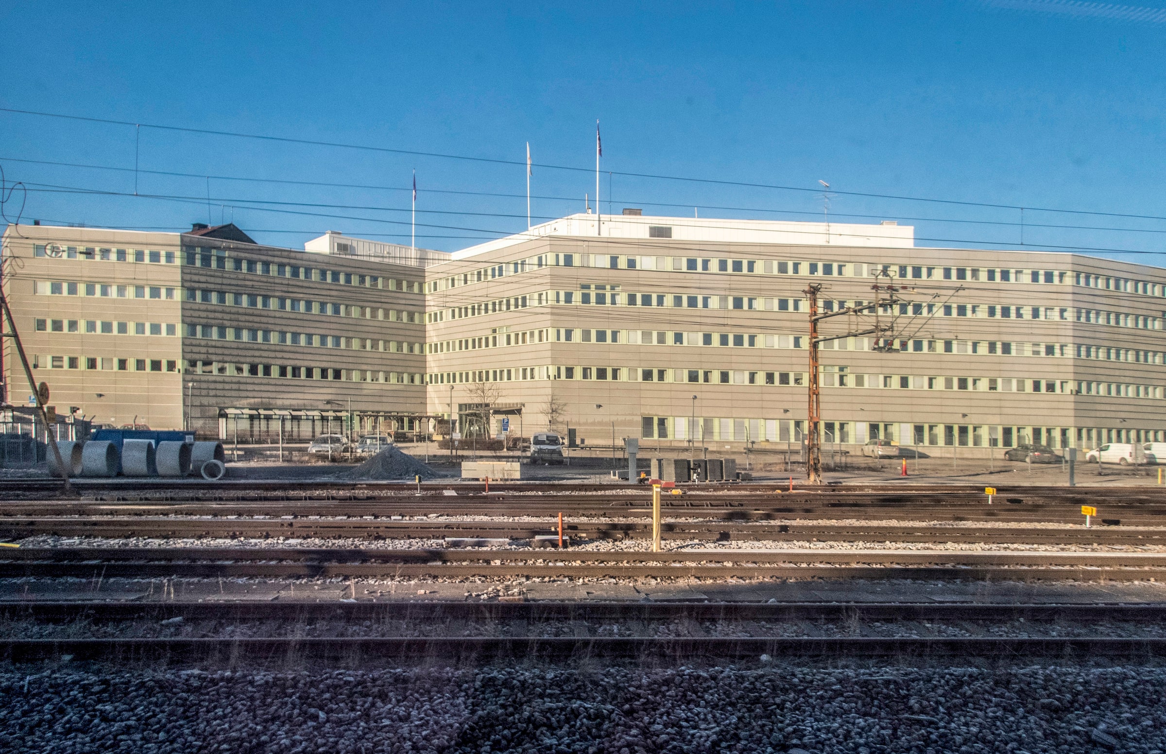 The Swedish Migration Agency office complex in Solna seen across railway tracks.